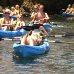 Group of Tourists on Kayaks