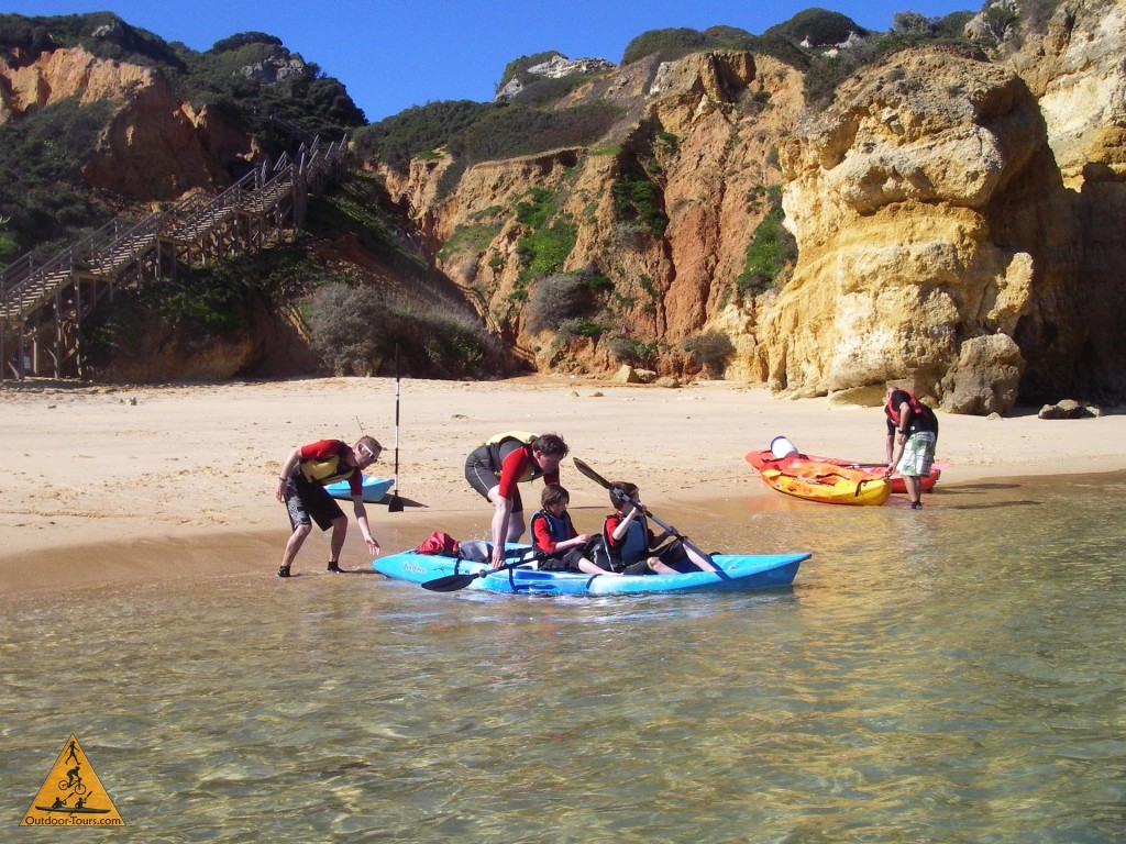Launching Kayaks Into the Water off the Beach